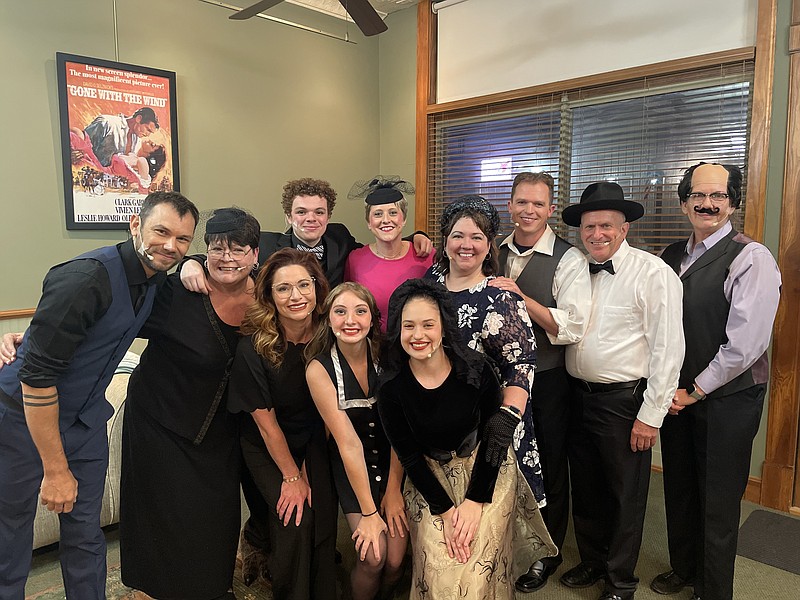 The cast of the Finke Theatre's "Southern Fried Funeral" gathers together to celebrate a job well done after their final performance on Saturday, June 11, 2022. (Democrat photo/Kaden Quinn)