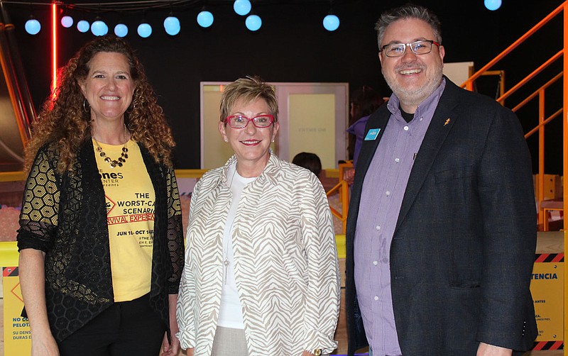 Terri Trotter, Jones Center president and CEO (from left); Celia Swanson, Jones Trust board chairwoman; and Sam Dean, Scott Family Amazeum executive director, visit at the VIP preview of Worst Case Scenario Survival Experience on June 8 at the JTL Shop in Springdale. The "hands-on, minds-on" touring exhibition runs through Oct. 14.

 
(NWA Democrat-Gazette/Carin Schoppmeyer)