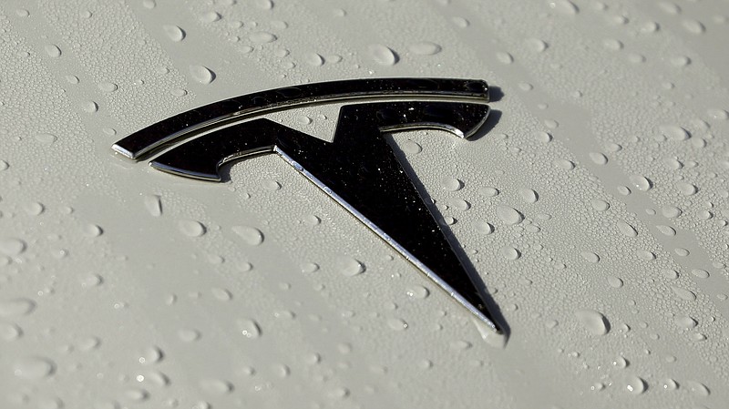 FILE - This Oct. 18, 2019, photo shows a Tesla logo in Salt Lake City. The government plans soon to release data on collisions involving vehicles with autonomous or partially automated driving system that will likely single out Teslas for a disproportionately high number of such crashes. In coming days, the National Highway Traffic Safety Administration plans to issue the figures, which it’s been gathering for nearly a year. Last week, the agency said in a separate report that it had documented more than 200 crashes involving Teslas that were using one of the company’s partially automated systems. The number of such Tesla crashes was revealed as part of a NHTSA investigation of Teslas on Autopilot that had crashed into emergency and other vehicles stopped along roadways. (AP Photo/Rick Bowmer, File)