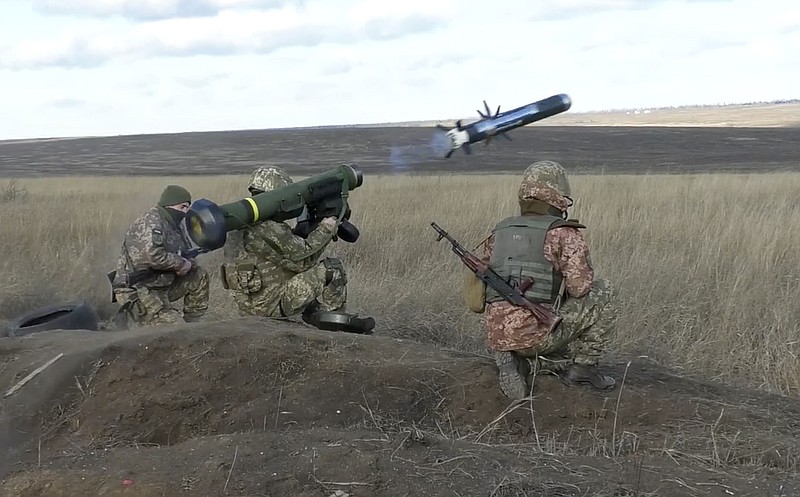 FILE - In this image taken from footage provided by the Ukrainian Defense Ministry Press Service, a Ukrainian soldiers use a launcher with US Javelin missiles during military exercises in Donetsk region, Ukraine, Wednesday, Jan. 12, 2022. The Russian invasion of Ukraine is the largest conflict that Europe has seen since World War II, with Russia conducting a multi-pronged offensive across the country. The Russian military has pummeled wide areas in Ukraine with air strikes and has conducted massive rocket and artillery bombardment resulting in massive casualties. (Ukrainian Defense Ministry Press Service via AP, File)