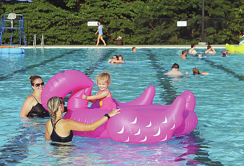 Cosette Stockman, 2, takes a ride on an inflatable flamingo in July 2021 during the Trolls Pool Party at Ellis-Porter Riverside Pool in Jefferson City. (Jason Strickland/News Tribune file photo)