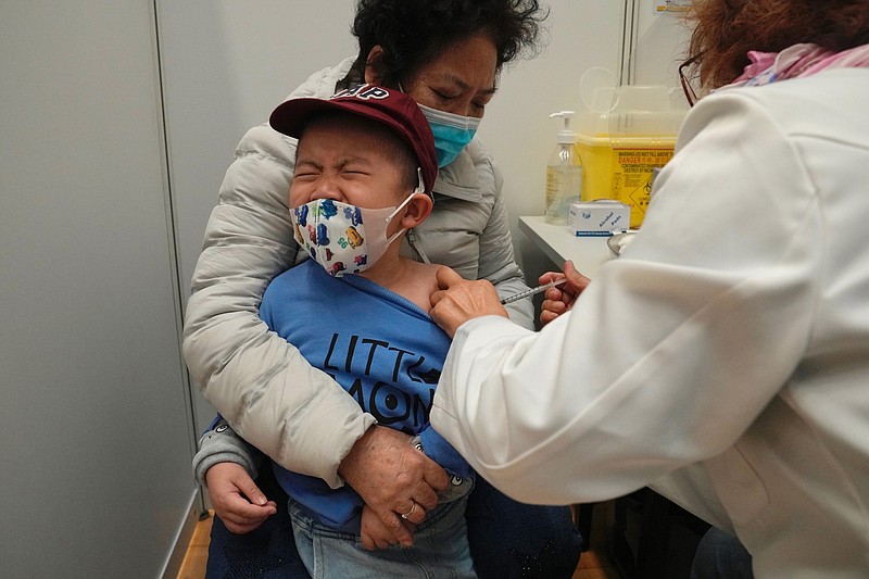 A boy receives a dose of China's Sinovac COVID-19 coronavirus vaccine at a community vaccination center in Hong Kong on Feb. 25, 2022. U.S. government advisers met Wednesday, June 15, 2022 to decide whether to endorse COVID-19 shots for babies, toddlers and preschoolers, moving the nation closer to vaccinations for all ages. According to the World Health Organization, 12 countries are vaccinating kids under 5. (AP Photo/Kin Cheung, File)