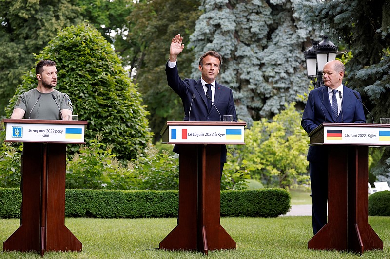 From left, Ukraine President Volodymyr Zelenskyy, France's President Emmanuel Macron and German Chancellor Olaf Scholz attend a press conference in Kyiv, Thursday, June 16, 2022. The leaders of four European Union nations visited Ukraine on Thursday, vowing to back Kyiv's bid to become an official candidate to join the bloc in a high-profile show of support for the country fending off a Russian invasion. (Ludovic Marin, Pool via AP)