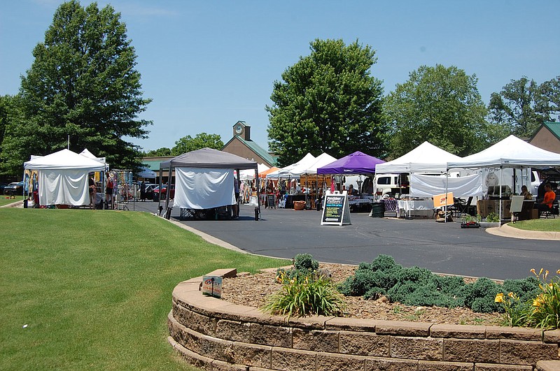 Bennett Horne/The Weekly Vista The Bella Vista Farmers Market, which offers a wide variety of home grown and hand made merchandise from a large group of vendors, is set up each Sunday through October from 9 a.m. to 2 p.m. at the Village Center parking lot off Lancashire Blvd.