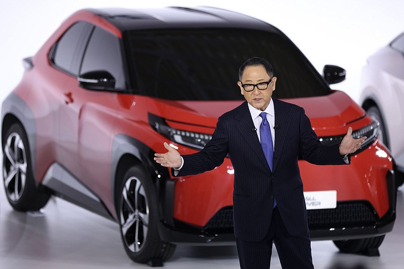 Akio Toyoda, president of Toyota Motor Corp., speaks in front of a prototype of the company's bz series during a news conference at the company's showroom in Tokyo, Japan, on Dec. 14, 2021. MUST CREDIT: Kiyoshi Ota
