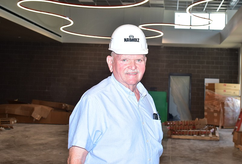 Retiring White Hall School District Superintendent Doug Dorris leads a tour of the fine arts center under construction at White Hall High School on Monday, June 13, 2022. (Pine Bluff Commercial/I.C. Murrell)