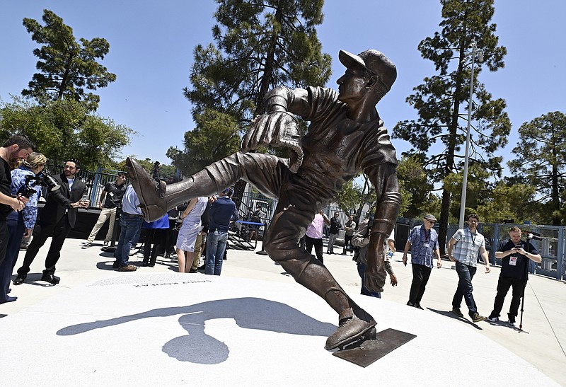 The Los Angeles Dodgers unveil a Sandy Koufax statue in the Centerfield Plaza to honor the Hall of Famer and three-time Cy Young Award winner prior to a baseball game between the Cleveland Guardians and the Dodgers at Dodger Stadium in Los Angeles, Saturday, June 18, 2022. (Keith Birmingham/The Orange County Register via AP)