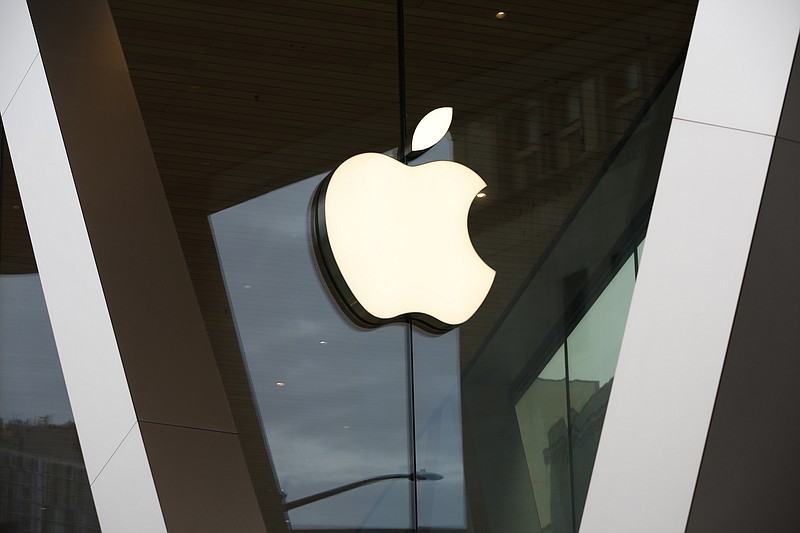 FILE - The Apple logo adorns the facade of a retail store. More than 100 employees of an Apple store in a suburb of Baltimore voted to unionize by a nearly 2-to-1 margin Saturday, June 18, 2022, joining a growing U.S. push across tech, retail and service industries to organize for greater workplace protections, a union said. (AP Photo/Kathy Willens, File)