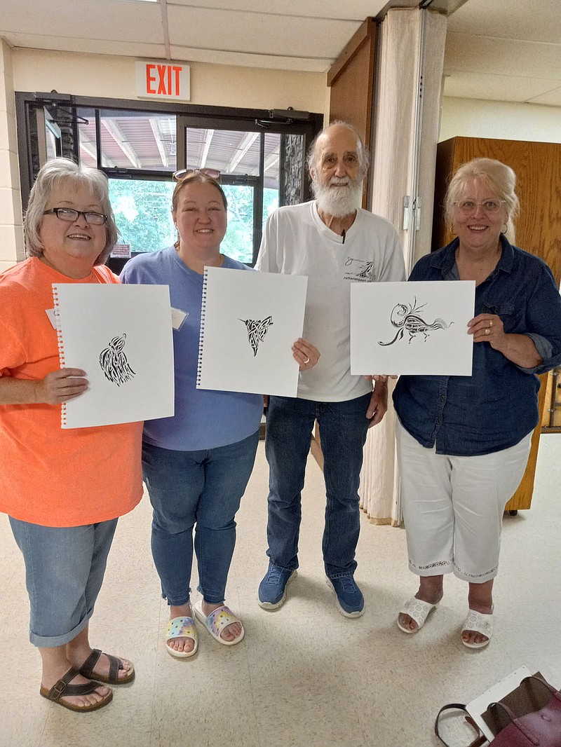Photo submitted The Ozark Creative Artists members enjoyed a lesson on Ink Art from artist James Rather of “Rather Unique Art” on Saturday, June 11, at Forrest Hills Baptist Church in Bella Vista. Pictured displaying their masterpieces are (from left) Becky Tomlinson, Abby Jones, instructor James Rather and Betty Blakeley.