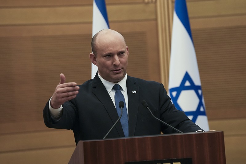 Israeli Prime Minister Naftali Bennett speaks during a joint statement with Foreign Minister Yair Lapid, at the Knesset, Israel's parliament, in Jerusalem, Monday, June 20, 2022. Bennett's office announced Monday, that his weakened coalition will be disbanded and the country will head to new elections. Bennett and his main coalition partner, Yair Lapid, decided to present a vote to dissolve parliament in the coming days, Bennett's office said. Lapid is then to serve as caretaker prime minister. The election, expected in the fall, would be Israel's fifth in three years. (AP Photo/Maya Alleruzzo)