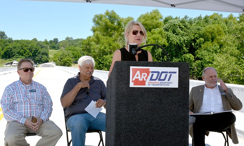 Marc Hayot/Herald-Leader ArDOT director Lori Tudor (center) speaks about the opening of Osage Creek Bridge on Monday. Osage Creek Bridge was completed a month earlier.