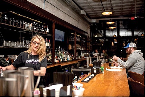 LEFT: Pecan Point bartender Christie Gilbreath serves unique beverages to patrons. (Staff photo by Erin DeBlanc)