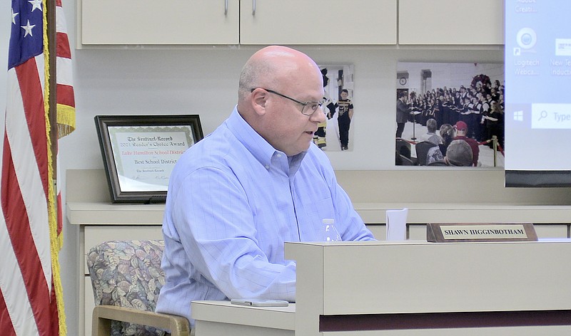 Lake Hamilton School Superintendent Shawn Higginbotham comments during his superintendent's report Monday night. - Photo by Donald Cross of The Sentinel-Record