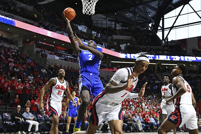 FILE - Memphis center Jalen Duren shoots over Mississippi guard Austin Crowley during the first half of an an NCAA college basketball game in Oxford, Miss., Saturday, Dec. 4, 2021. Duren is one of the top big men in the 2022 NBA draft. (AP Photo/Thomas Graning, File)