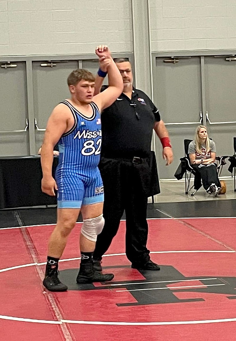 Photo submitted
McDonald County wrestler Samuel Murphy has his hand raised in victory by an official last week during the USA Wrestling Junior National Duals in Tulsa, Okla. Murphy went 4-2 in Greco Roman and 7-1 in Freestyle.