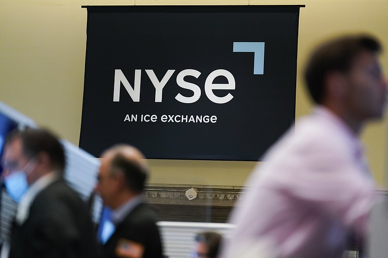 An NYSE sign is seen on the floor at the New York Stock Exchange in New York, Wednesday, June 15, 2022.  Stocks are opening lower on Wall Street, Wednesday, June 22,  as sharp drops in crude oil prices pull energy companies lower. Big technology stocks were also lower, but major indexes were still holding on to gains for the week.   (AP Photo/Seth Wenig)