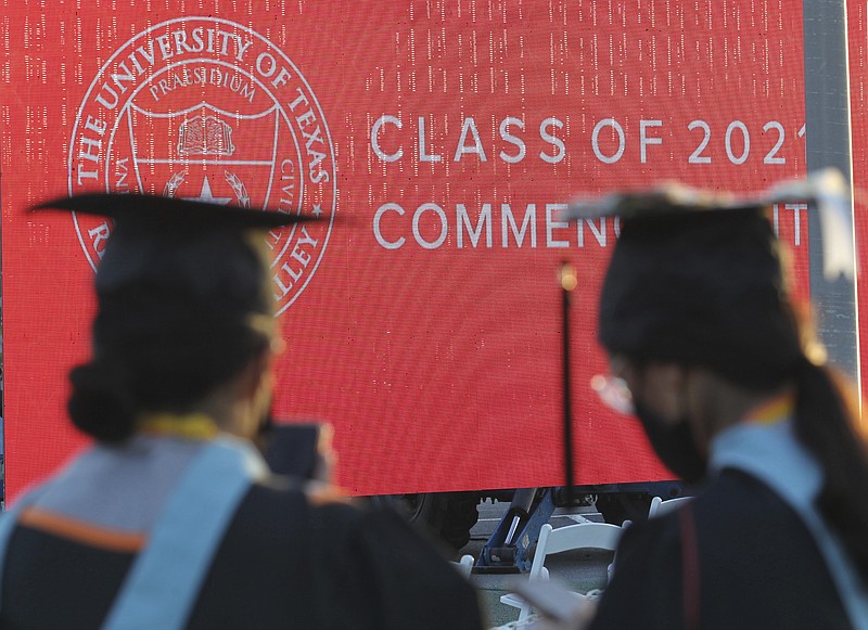 FILE - Graduates of the University of Texas Rio Grande Valley attend the commencement ceremony in the schools parking lot Friday, May 7, 2021, in Edinburg, Texas. Buy now, pay later financing options are increasingly being offered by for-profit credentialing schools and boot camps. The “learn now, pay later” concept is appealing, and students are already familiar with the namebrand companies, since buy now, pay later is ubiquitous within online retail.  (Delcia Lopez/The Monitor via AP, File)