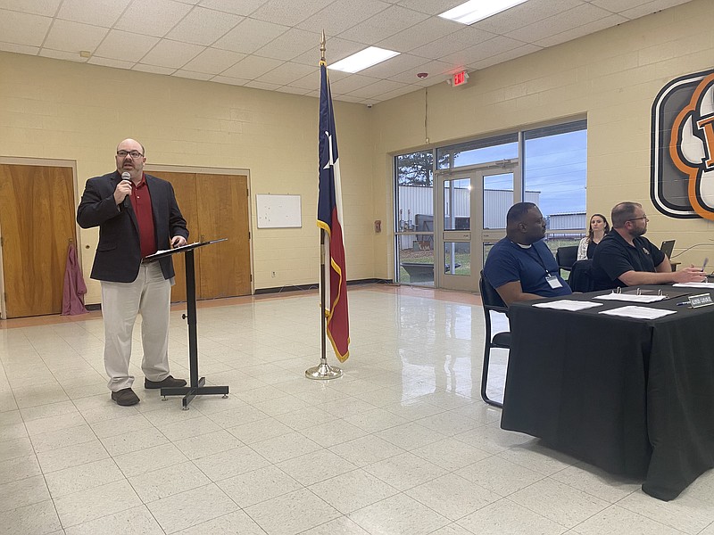 DeKalb ISD Superintendent Dr. Chris Galloway speaks during a public hearing on a four-day school week Monday, March 21, 2022, as board members observe a slide presentation. (Staff photo by Andrew Bell)