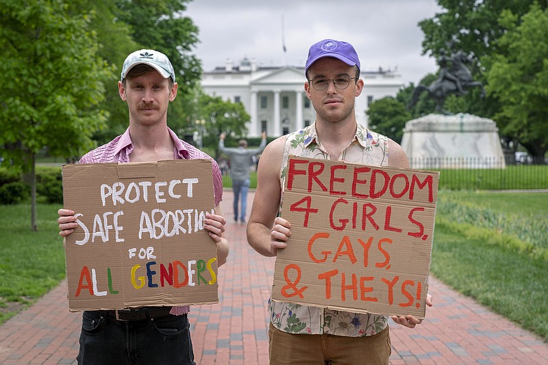 Rob Zajdel, 28, left, and Danny Drees, 27, of Washington, pose for a portrait as they join abortion rights protesters Saturday, May 14, 2022, outside the White House in Washington before marching to the Supreme Court. "Its important for me, identifying as a man, to have that present here. It's important for all of us to come together, it's not just a women's issue. They shouldn't have to be the only ones making noise about this," Zajdel said. "I don't think these rulings will stop at abortion, one of the next things that could be overturned is gay marriage." Drees added, "At the heart of this debate is body autonomy. Our right to privacy is on the chopping block." (AP Photo/Jacquelyn Martin)