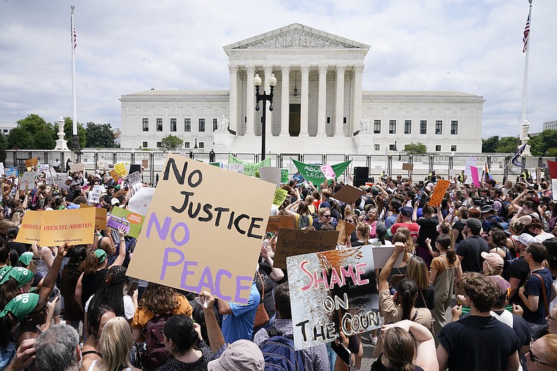 Protesters gather outside the Supreme Court Friday, June 24, 2022, in Washington. The Supreme Court has ended constitutional protections for abortion that had been in place nearly 50 years, a decision by its conservative majority to overturn the court's landmark abortion cases. (AP Photo/Jacquelyn Martin)