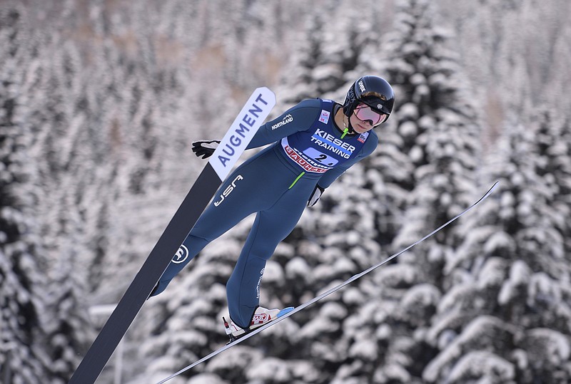 FILE - United States' Annika Malacinski competes during the Nordic combined World Cup mixed team normal hill HS 106, in Val di Fiemme, Italy, Jan. 7, 2022. Malacinski is one of dozens of women around the world who are in it for the glory, sacrificing a lot of time and money to go for Olympic gold. (AP Photo/Elvis Piazza, File)