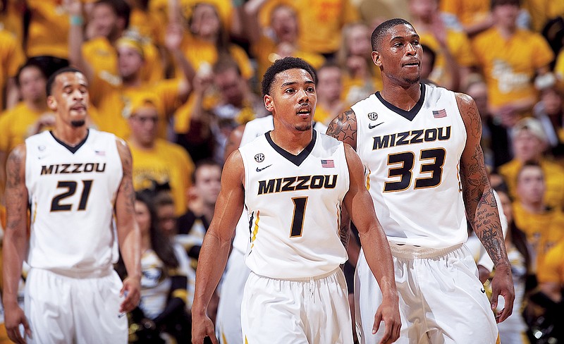 In this March 5, 2013, file photo, Missouri's Phil Pressey, center, walks up court after a timeout during the first half of a game against Arkansas at Mizzou Arena in Columbia. (Associated Press)