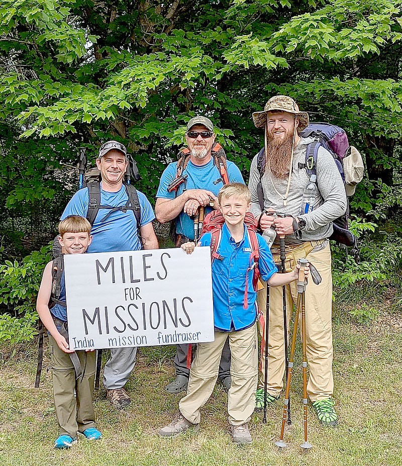 COURTESY PHOTO
Casey Jones, standing center in the back row, led this backpacking trip for Miles for Missions, a hiking fundraiser he started to raise money for children's homes in and near Chennai, India. Others on the 37-mile trip completed in May on the Buffalo National River trail, included Able Patterson, 9, and Maverick Connor, 11, in the front, and James Patterson and Sam Hodges in the back.