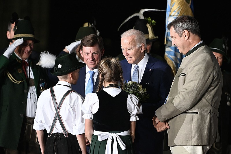President Joe Biden is greeted as he arrives at the Munich International Airport in Germany to attend the G7 summit, June 25, 2022. As Biden heads to Europe for summit meetings with the Group of 7 in Germany and with NATO in Spain, he must prepare U.S. allies for a long conflict in Ukraine amid shocks in the food and energy markets, and inflation on a scale few imagined six months ago. (Kenny Holston/The New York Times)