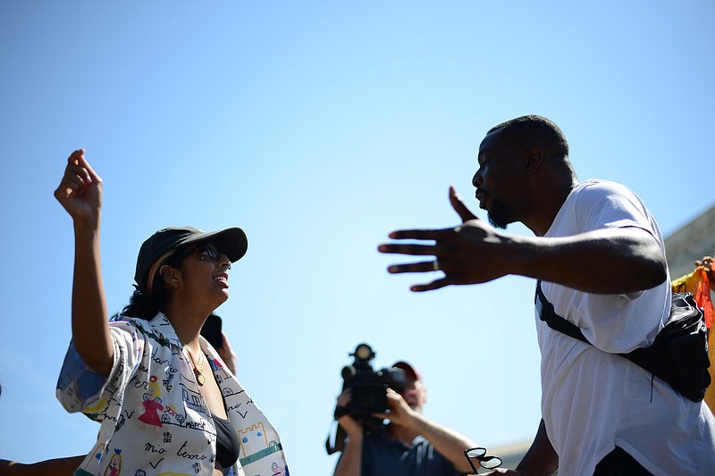 An abortion rights activist, left, and an antiabortion activist, right, outside the Supreme Court on June 25. MUST CREDIT: Photo for The Washington Post by Astrid Riecken.