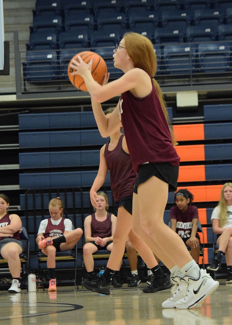 Westside Eagle Observer/MIKE ECKELS
Lady Pioneer Lilly Schopper puts up a long jumper from just behind the top of the lane during the Gentry-Rogers Oakdale junior high basketball game at Heritage High School's main gym in Rogers June 24. Schopper landed her shot for a field goal.