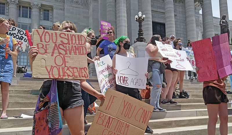 A few dozen pro-choice supporters at the Capitol on Sunday, June 26, 2022, were protesting the U.S. Supreme Court's decision to overturn Roe V. Wade. With a trigger ban in place, Missouri became the first state to outlaw abortions following the high court's decision, but rally-goers said the debate is not settled in Missouri. (Ryan Pivoney/News Tribune photo)