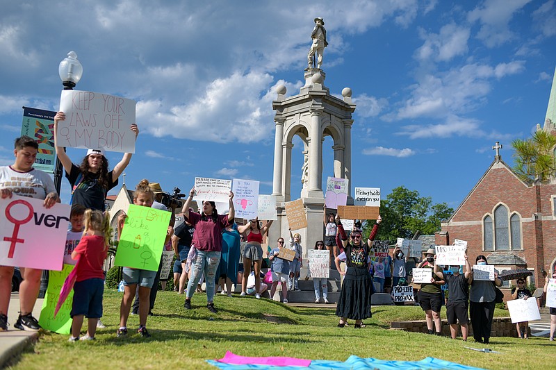 Pro-choice advocates rally around a Confederate monument during the Post-Decision Protest on Sunday, June 26, 2022, in downtown Texarkana. The protest, organized by Pro Choice TXK, was in response to Friday's Supreme Court decision overturning Roe v. Wade. (Staff photo by Erin DeBlanc)