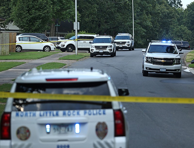 Authorities investigate the scene of an officer-involved shooting on the 3100 block of Donaghey Drive in North Little Rock on Sunday, June 26, 2022. According to information released by the North Little Rock Police Department, a suspect was killed after firing on officers responding to a domestic disturbance call. One officer sustained non-life threatening injuries and a K-9 was transported to a local animal hospital for treatment. (Arkansas Democrat-Gazette/Colin Murphey)