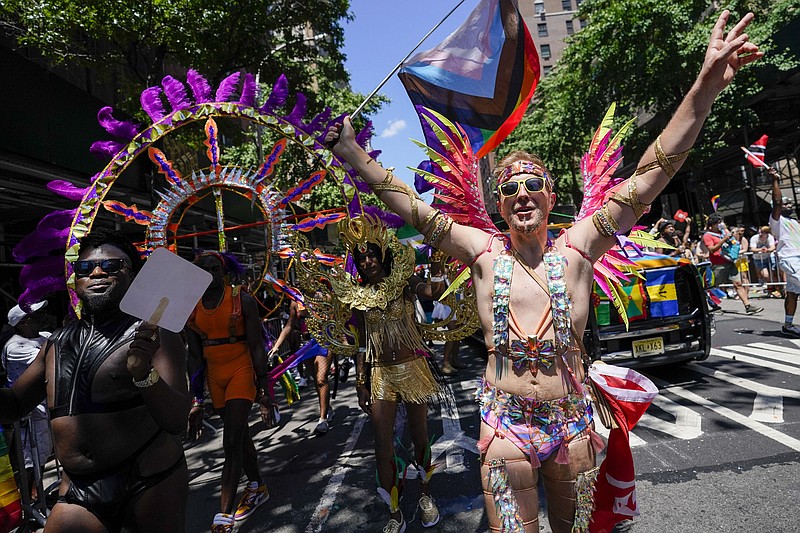 Revelers march down Fifth Avenue during the annual NYC Pride March, Sunday, June 26, 2022, in New York. (AP Photo/Mary Altaffer)