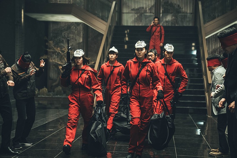 Jeon Jong-seo (from left) plays Tokyo, Hyun-woo Lee is Rio, Yoon-ju Jang is Nairobi, Park Hae-soo is Berlin, Won-jong Lee is Moscow and Kim Ji-hoon is Denver in “Money Heist: Korea — JEA.” (Netflix/Jung Jaegu)