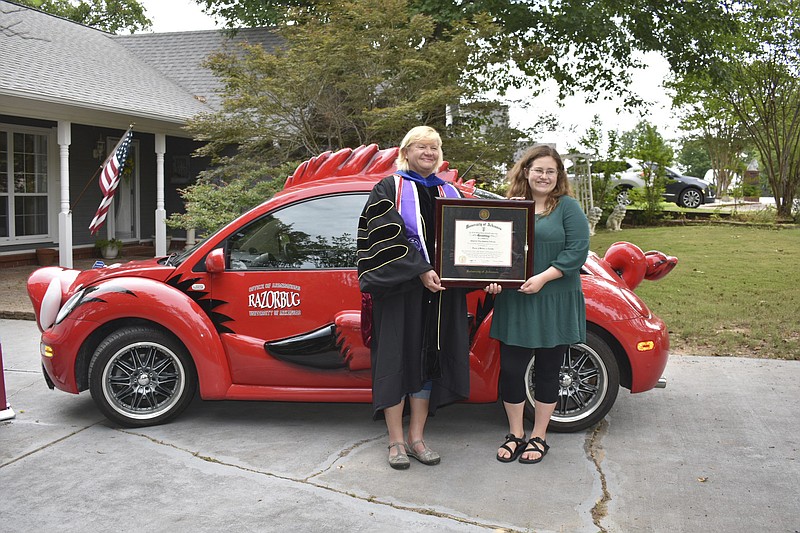 Cheyenne “Star” Lowrey-LaGrone received her master of science innursing from Jan Emory, associate professor of nursing, at her home in Fort Smith. 
(Courtesy Photo/University of Arkansas/Heidi Wells)