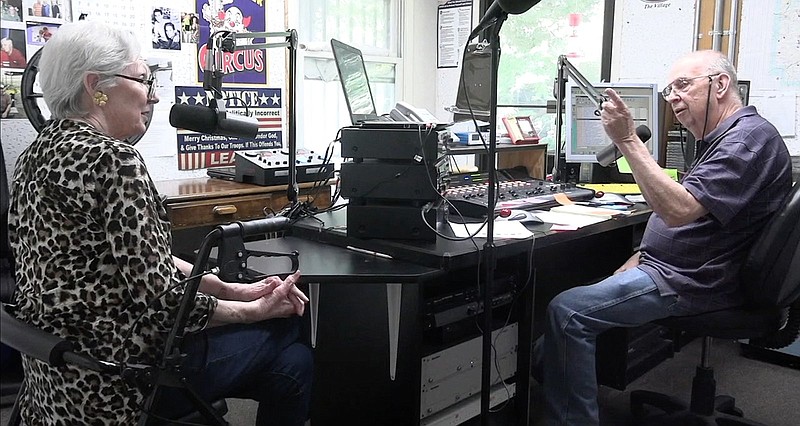 Polly Nichols, left and Scotty Mack talk during “The Scotty and Polly Show,” their live show on KVRE. – Photo by Courtney Edwards of The Sentinel-Record