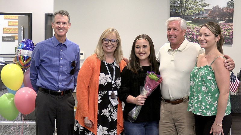 From left, NPC President John Hogan, Dean of Financial Services Lisa Hopper, Kaitlyn Graves, Lloyd Robertson, and US Stations Account Executive Kristen Connelly pose for a photo during the ceremony. - Photo by Donald Cross of The Sentinel-Record