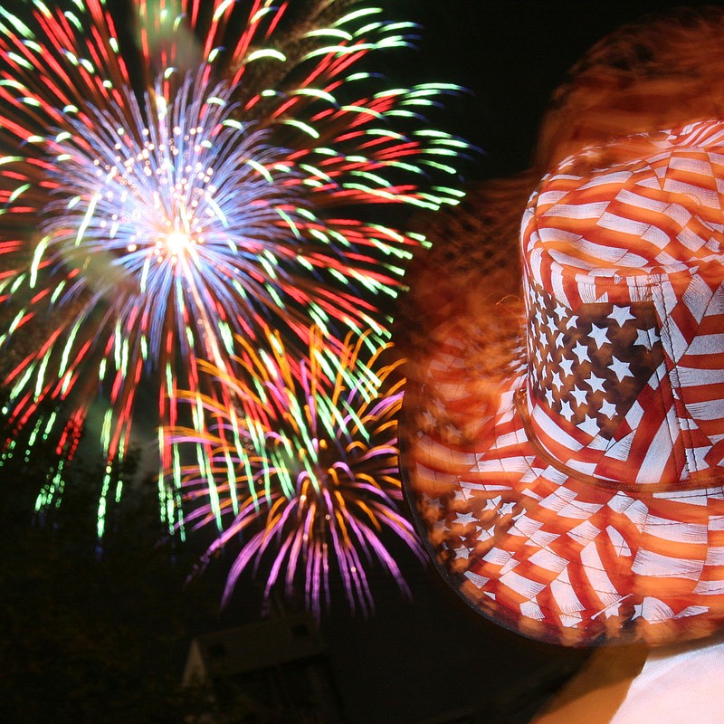 Arkansas Democrat-Gazette/ DAN HALE 7-4-05 - Stephen Barba, of Fort Smith, sports a patriotic hat while watching the fireworks at the River Market on Monday night in Little Rock.