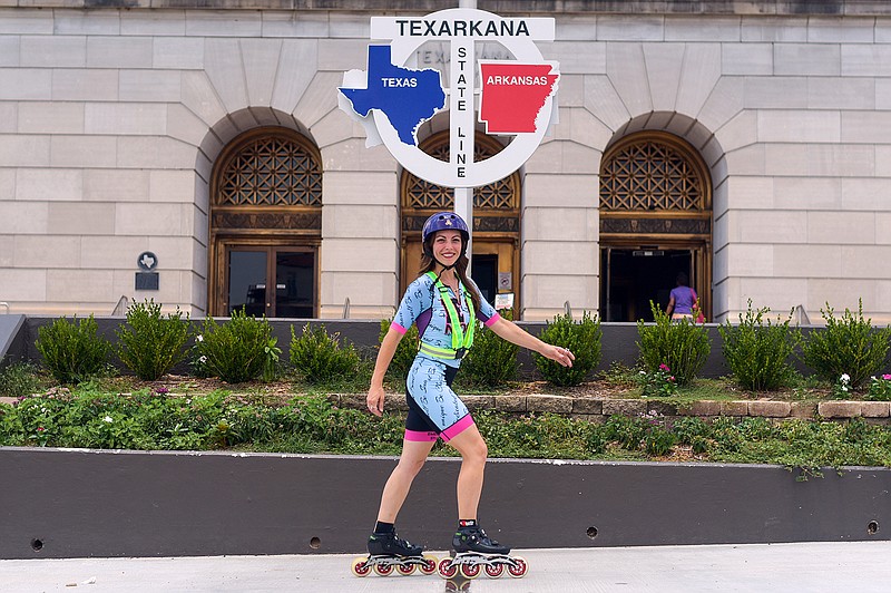Natalia Victoria skates across the Arkansas-Texas state line during her stop Thursday, June 23, 2022, in Texarkana. Victoria is on a 1,100-mile journey inline skating from Houston to Chicago, with hopes to inspire other people to chase their dreams. (Staff photo by Erin DeBlanc)