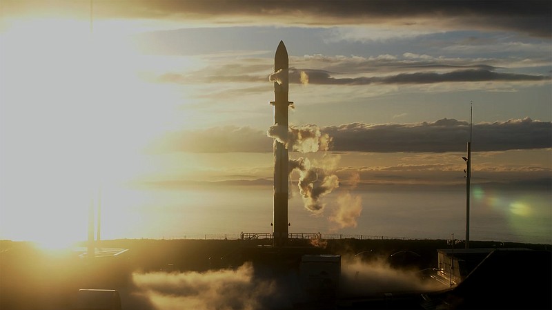 In this photo released by Rocket Lab, Rocket Lab's Electron rocket sits on the launch pad on the Mahia peninsula in New Zealand on May 17, 2022. NASA plans to send up a satellite to track a new orbit around the moon which it hopes to use in the coming years to once again land astronauts on the lunar surface. (Rocket Lab via AP)