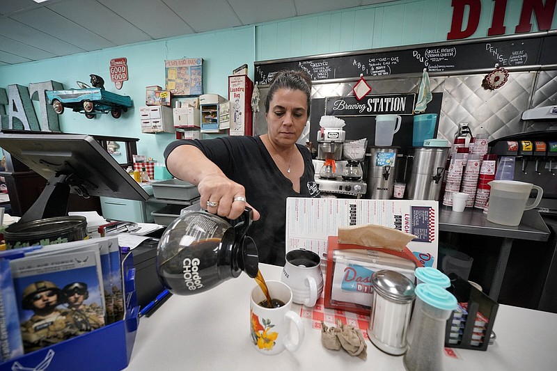 Tiffany Hollis, center, owner of the Dashing Diner, in Johnstown, Ohio, works the lunchtime rush, Thursday, June 9, 2022. (AP Photo/Gene J. Puskar)