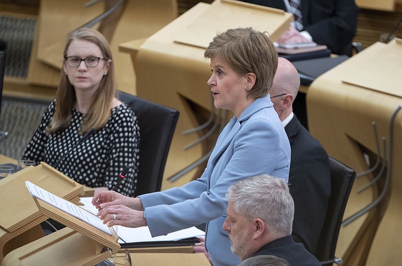 Scotland's First Minister Nicola Sturgeon delivers a statement to lawmakers in the Scottish Parliament, Edinburgh, Tuesday June 28, 2022, on her plans to hold a fresh referendum on Scottish independence on Oct. 19, 2023. Scottish voters rejected independence in the 2014 referendum, with 55% of voters saying they wanted to remain part of the United Kingdom. (Lesley Martin/PA via AP)