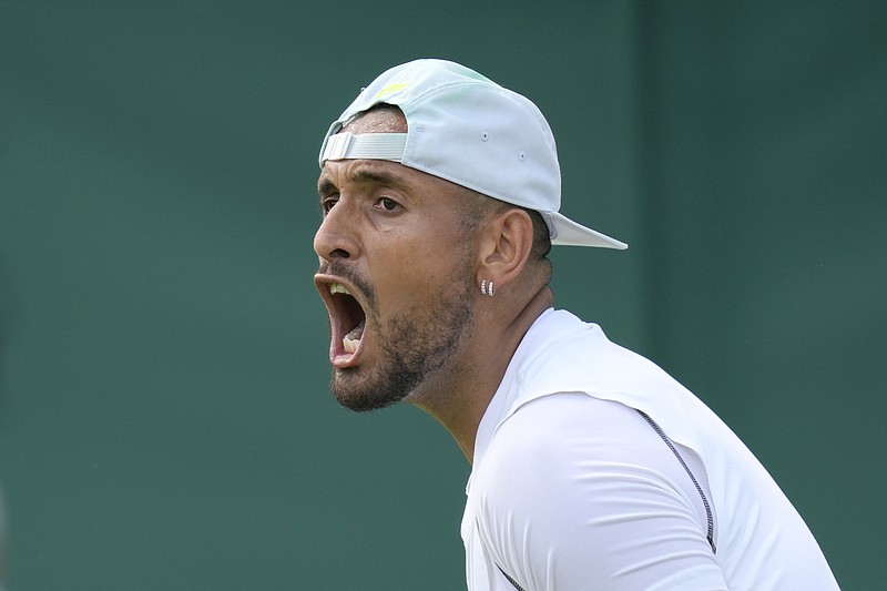 Australia's Nick Kyrgios celebrates retaining a service game during the singles tennis match against Britain's Paul Jubb on day two of the Wimbledon tennis championships in London, Tuesday, June 28, 2022. (AP Photo/Kirsty Wigglesworth)