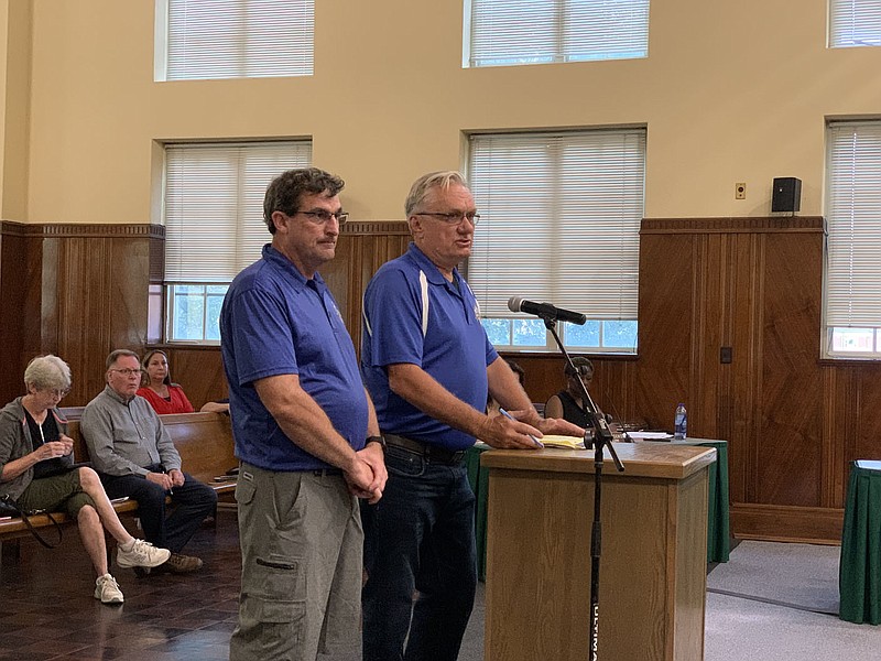 Ben Thomas, right, and Stephen Gatesman, left, of the River Valley Futbol Club speak during the public comments portion of the Sebastian County Quorum Court’s meeting June 21. 
(NWA Democrat-Gazette/Thomas Saccente)