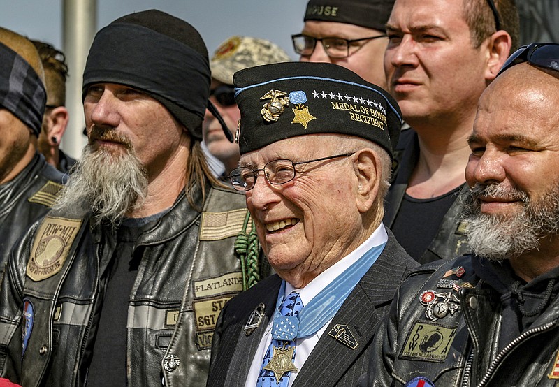 Hershel "Woody" Williams, center, poses with fellow Marines at the Charles E. Shelton Freedom Memorial at Smothers Park, Saturday, April 6, 2019, in Owensboro, Ky. Williams, the last remaining Medal of Honor recipient from World War II, died Wednesday, June 29, 2022 He was 98. Williams' foundation announced on Twitter and Facebook that he died at the Veterans Affairs medical center bearing his name in Huntington. (Greg Eans/The Messenger-Inquirer via AP, File )
