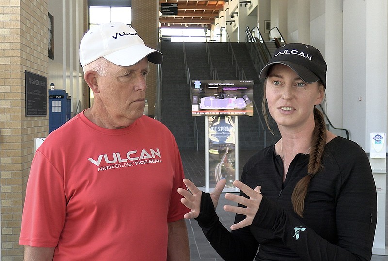 Kefi Pickleball owners David Tappe, left, and Kate Tully explain the format of the Spa City Classic inside the Bank OZK Arena Wednesday. - Photo by Donald Cross of The Sentinel-Record