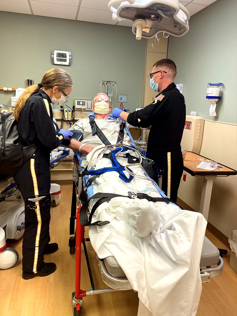 Paramedics take care of David Kleindienst during a recent hospital visit. SUBMITTED