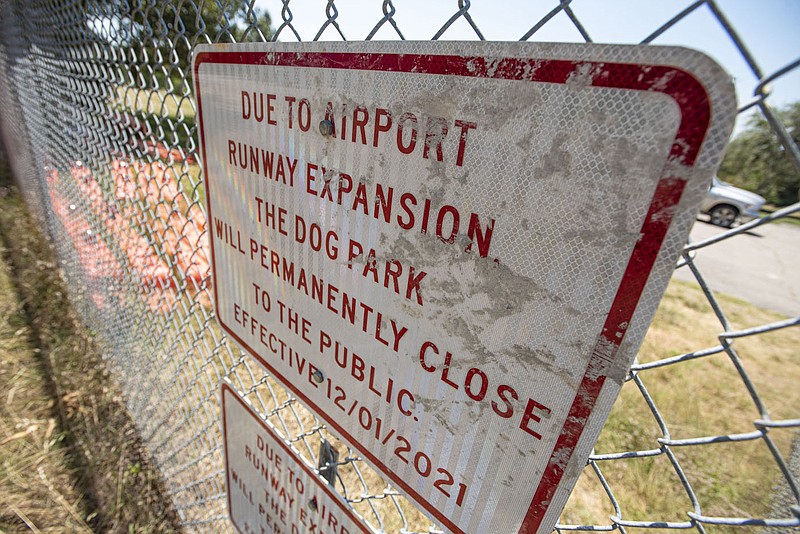 A sign displays on Thursday, June 30, 2022, at the former site of the Fort Smith Dog Park in Fort Smith. The cityâ€™s Board of Directors this week heard a proposal to build a new dog park at Chaffee Crossing after the first one was closed to expand the runway at the Fort Smith Regional Airport. Visit nwaonline.com/220703Daily/ for today's photo gallery.
(NWA Democrat-Gazette/Hank Layton)