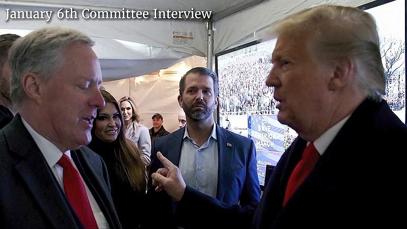 This exhibit from video released by the House Select Committee shows a photo of former President Donald Trump talking to his chief of staff, Mark Meadows, before Trump spoke at the rally on the Ellipse on Jan 6, 2021. The video was played Tuesday, June 28, 2022, at a hearing by the House select committee investigating the Jan. 6 attack on the U.S. Capitol. (House Select Committee via AP)